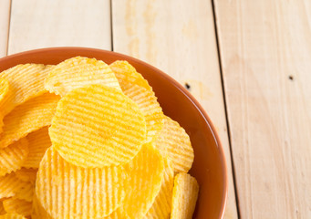potato chips on wood background