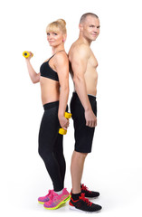 Athletic middle-age man and woman posing in studio