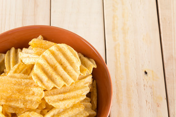 potato chips on wood background