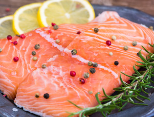 Raw Salmon Fish Fillet with Lemon and Fresh Herbs