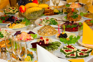 Banquet table/ Beautifully decorated different meals and snacks for the wedding banquet at a restaurant, selective focus