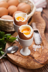 Boiled eggs on a wooden background