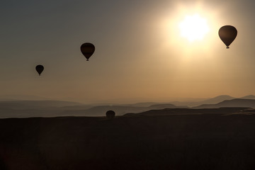 Ballons over Mointains in cappadocia