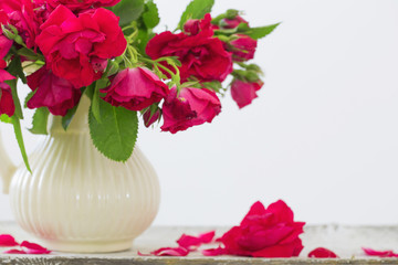 red roses in jug