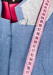tailoring of collar for blue jacket on dummy