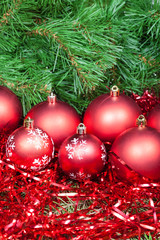 many red Christmas balls, tinsel and Xmas tree