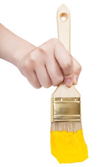 front view of painter hand with yellow paintbrush