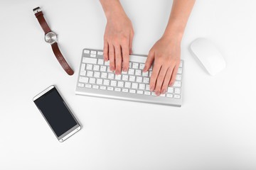 Fototapeta na wymiar Female hand with computer keyboard isolated on white
