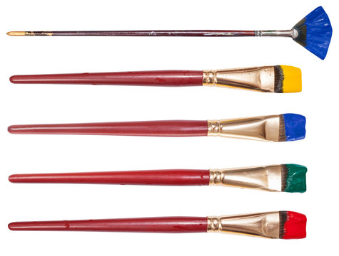 set of flat artistic paintbrushes with painted tips