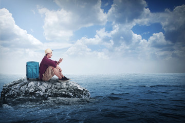 Asian traveler man alone at the small island