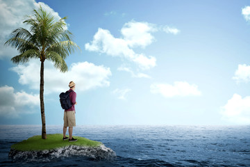 Traveler man standing on the small island on the sea