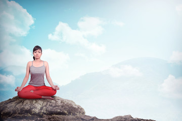 Woman Doing Yoga At The Mountain