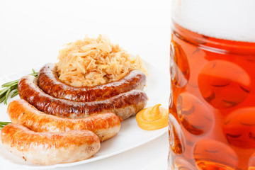 Fototapeta na wymiar Oktoberfest menu, beer mug, a plate of sausages and sauerkraut