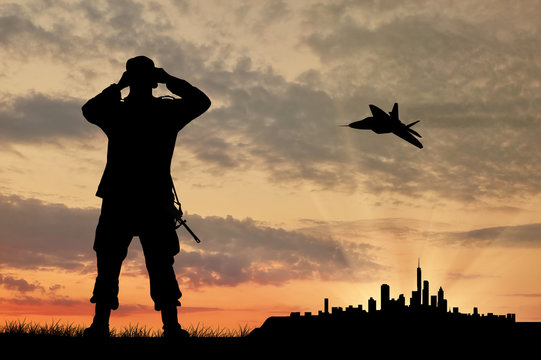 Silhouette of a soldier and an airplane