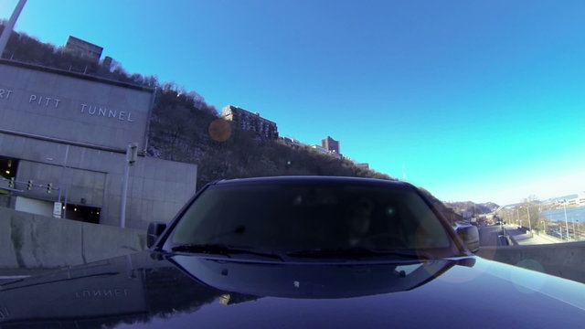 A reverse perspective of driving over the Fort Pitt Bridge in downtown Pittsburgh, Pennsylvania.	