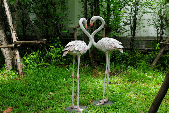 statue bird background garden two animal flamingo