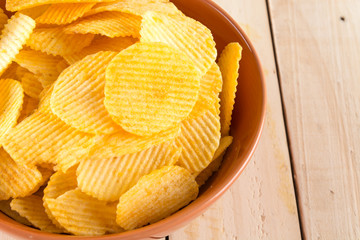 potato chips on wood background