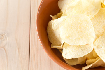 potato chips on wood background