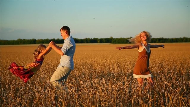 happy family in a wheat field
