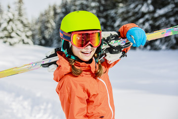 Ski, skier girl enjoying winter vacation