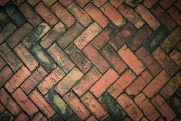 Red brick paving stones on a sidewalk
