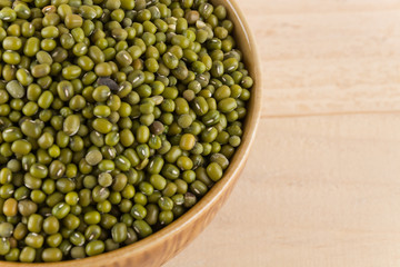 green beans on wood background