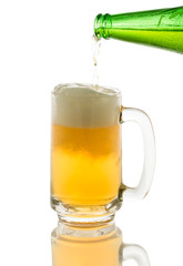 pouring beer to glass isolated on white