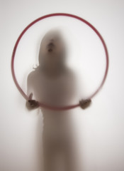 shadow of a girl behind transparent paper