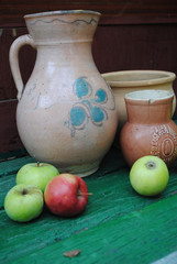 Old vases, bowl, pitcher and apples