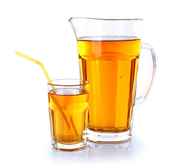 Full jug and glass of apple juice isolated on white