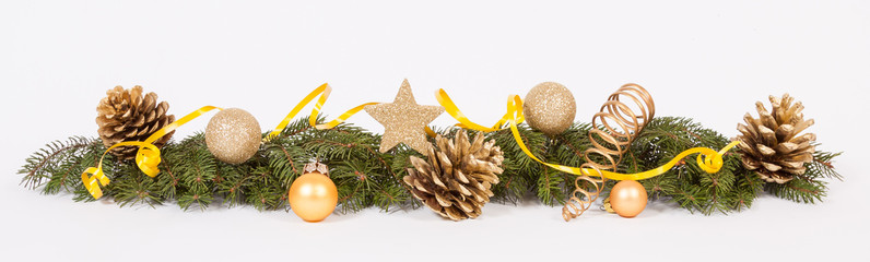 Christmas decoration with the twigs of the spruce, cones and baubles