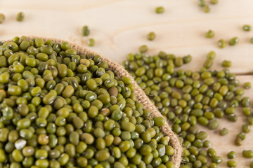 green beans on wood background