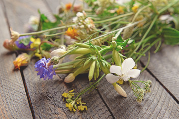 Wildflowers on wooden table, closeup