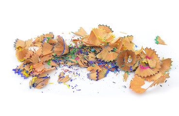 Shavings from multicolored pencils on white background