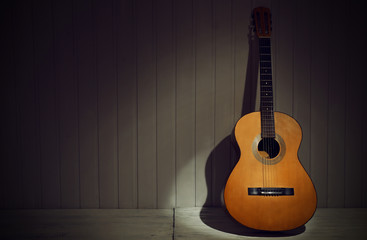 Fototapeta na wymiar Classical guitar on wooden background