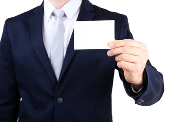 Elegant man in suit with business card close up