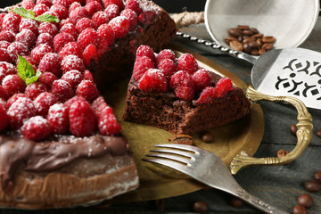 Cake with Chocolate Glaze and raspberries on wooden background