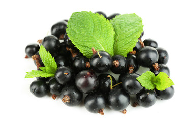Ripe black currant isolated on white