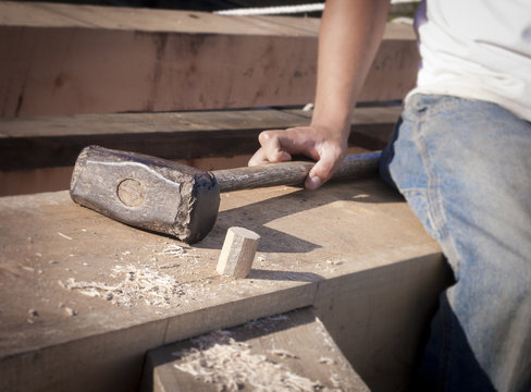 Timberframe Carpenter and Sledgehammer