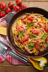 Homemade Spaghetti Bolognese on pan, on wooden background