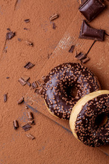 Donuts with cocoa powder and chocolate