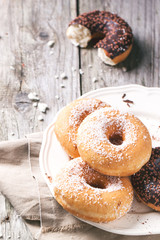 Donuts over wooden background