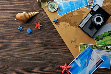 Marine composition with compass and cards on table close up