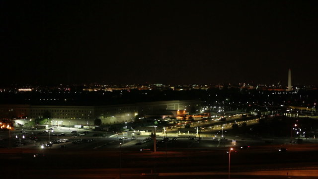 The Pentagon and busy highway at night in Washington DC, USA.