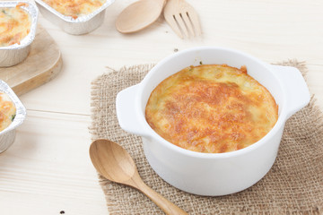 Baked spinach with cheese on wood