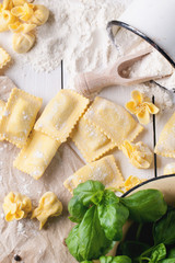 Pasta ravioli on flour with basil