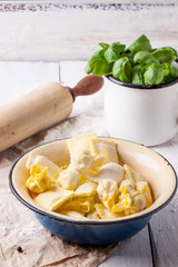 Pasta ravioli with flour and basil