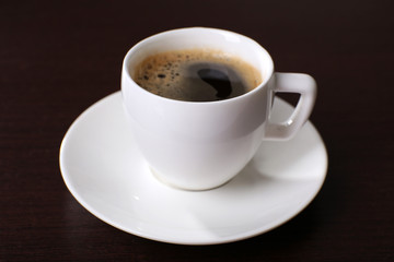 Cup of coffee on table close up