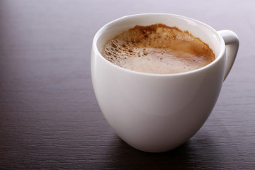 Cup of coffee on table close up