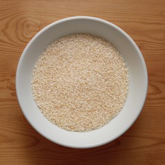 White Bowl with White Rice on Wooden Desk